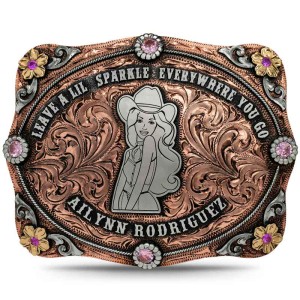 A custom belt buckle for women featuring a personalized cowgirl figure built on a hand engraved copper base